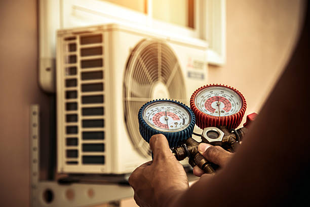 Professional Heat Pump Repair technician working in Mattapoisett, MA